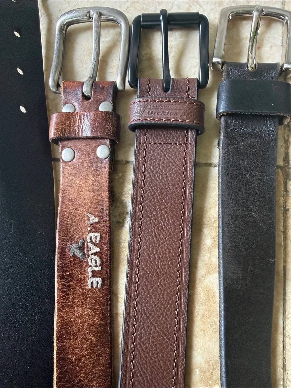 Men’s leather belts (3)  one American Eagle, one dickies and one no brand all 38